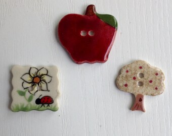 Porcelain Buttons, Hand-Painted, Set of 3, Two Hole; White, Red and Tan; Apple, Tree, & Lady Bug, 1 to 1 1/4 Inch Buttons