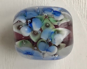 Lampwork Glass Bead, Blue & White Flowers, Clear Background, 1 Inch Length, Hand-Made Artisan Bead, Jewelry Crafting Supply