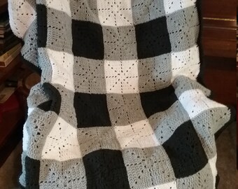 Buffalo plaid crocheted afghan in charcoal black, white and grey.