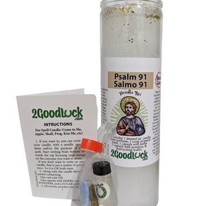May include: A white candle with gold glitter, a small bottle of oil, a packet of herbs, and a small instruction booklet. The candle has a label that reads "Psalm 91 Salmo 91 Victoria Rey".