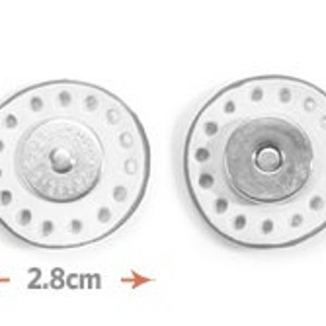 May include: Two silver magnetic snap buttons, each with a diameter of 2.8 inches, featuring a circle of small holes around the edge and a central button.