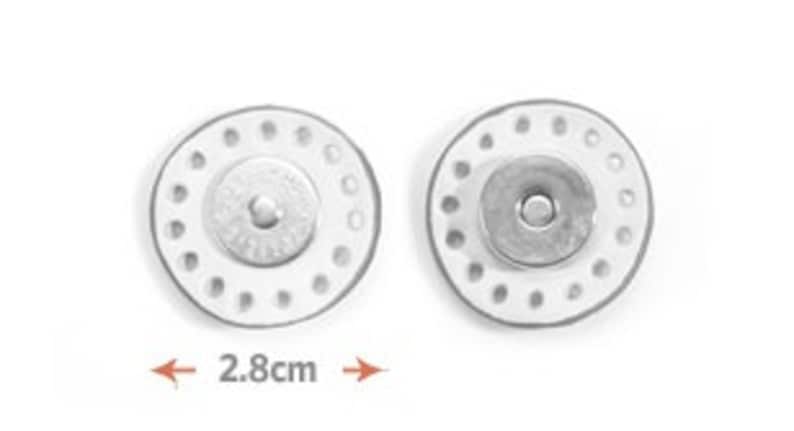 May include: Two silver magnetic snap buttons, each with a diameter of 2.8 inches, featuring a circle of small holes around the edge and a central button.