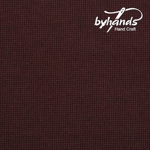 May include: A close-up of a dark brown fabric with a subtle textured pattern. The fabric has a slightly rough feel and a slightly shiny appearance.