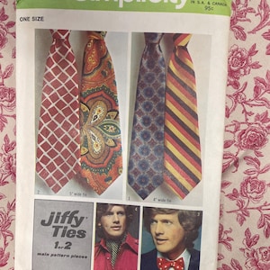May include: Vintage Simplicity sewing pattern for Jiffy Ties, featuring four tie designs: a red grid, an orange paisley, a blue floral, and a striped tie. The pattern includes instructions for ties that are 4 and 5 inches wide.