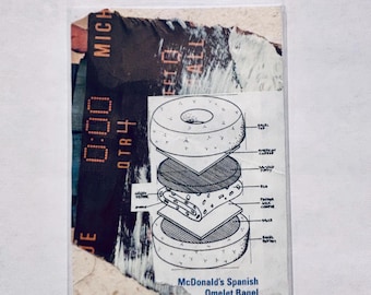 May include: A rectangular card featuring a collage design. On the left, a dark scoreboard graphic displays 0:00 QTR 4. On the right, a technical line drawing illustrates the layers of a McDonald's Spanish Omelet Bagel, labeled with ingredients.
