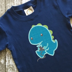 Dinosaur playing video game appliqué machine embroidery design