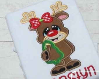 Girl reindeer holding cookie cutter appliqué embroidery design