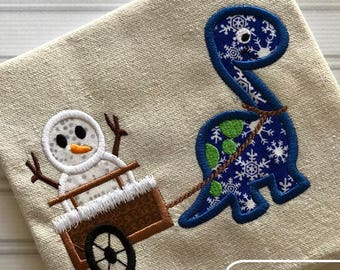 Dinosaur pulling cart with snowman appliqué machine embroidery design