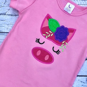 Pig face with flower appliqué machine embroidery design