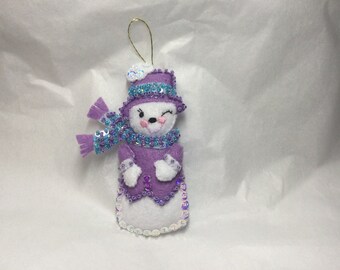 Snowman with purple jacket