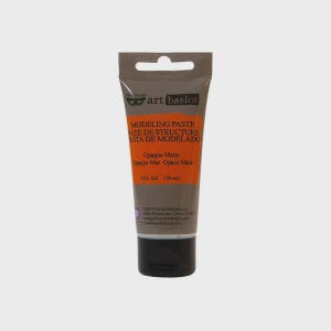 May include: A gray squeeze tube of Art Basics modeling paste with an orange label. The text reads Modeling Paste, Pâte de Structure, Pasta de Modelado, Opaque Matte, and 2 fl. oz. (59 ml). The tube features a black cap and a hang hole at the top.