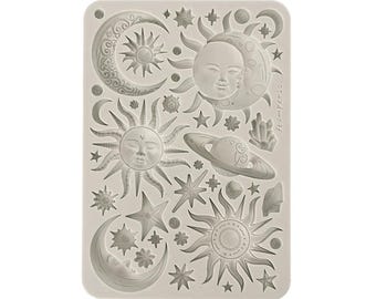 May include: A silicone mold with a design of multiple suns, moons, and stars. The mold is gray and has a textured surface. The text "TheImperfects" is printed on the side of the mold.