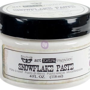 May include: A white jar with a black lid containing Finnabair Art Extravagance Snowflake Paste. The label features the text Snowflake Paste, 4 FL. OZ. (118 ml), and a butterfly graphic. This dense, white, permanent paste provides a structural effect.