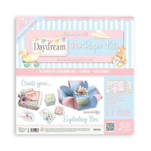 May include: A Stamperia Daydream 3D paper kit, featuring an exploding box, flowers, and accessories. The design uses a pastel blue and pink colour scheme, with illustrations of a duck, teddy bear, and paper aeroplane. The words "Daydream 3D Paper Kit" are clearly visible.
