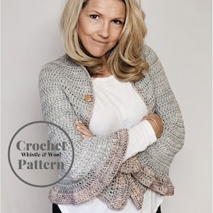 May include: A gray crochet shawl with a pink trim. The shawl is worn by a person with blonde hair. The text "Crochet Whistle & Wool Pattern" is in a circle on the image.