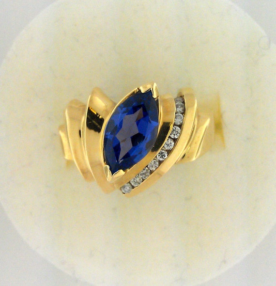 14K gold marquis tanzanite and diamond ring. Tanz… - image 1