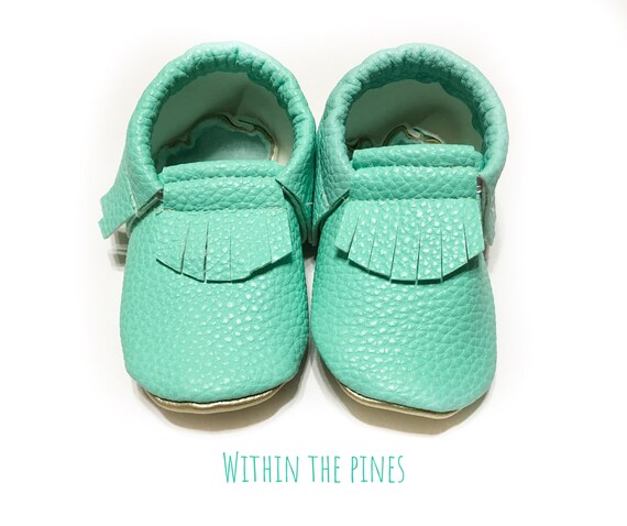 mint green baby shoes