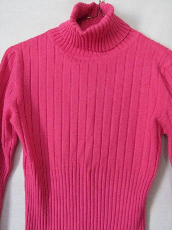 pink turtleneck sweater