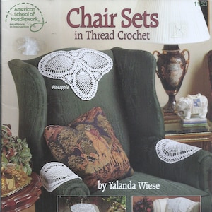 May include: Three crocheted chair sets in white thread. The chair sets include a seat cushion, two armrest covers, and a back cushion. The image shows the chair sets on three different chairs. The text on the image reads "Chair Sets in Thread Crochet" and "by Yalanda Wiese".