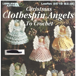 May include: A leaflet cover featuring crocheted clothespin angels in various colors: blue, pink, yellow, green, and gray. Each angel has a wooden bead head, white wings, and a crocheted dress. The text reads "Christmas Clothespin Angels To Crochet."