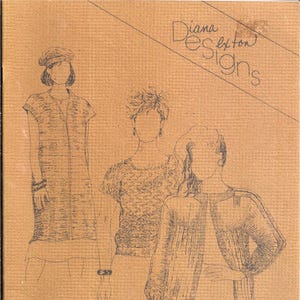 May include: A book cover with a brown background and the text "Diana Dayton Designs" in black. The cover features three drawings of women wearing different knitted garments. The text "Loomed Fashions from your knitting machine" is printed in black at the bottom of the cover.