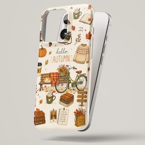 May include: A cream-colored phone case featuring an autumn-themed illustration with the text hello, AUTUMN. The design includes a green bicycle, a park bench, a sweater, a stack of blankets, a pumpkin, a mug, and various fall-themed icons.