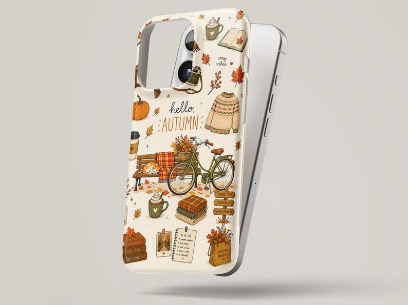 May include: A cream-colored phone case featuring an autumn-themed illustration with the text hello, AUTUMN. The design includes a green bicycle, a park bench, a sweater, a stack of blankets, a pumpkin, a mug, and various fall-themed icons.