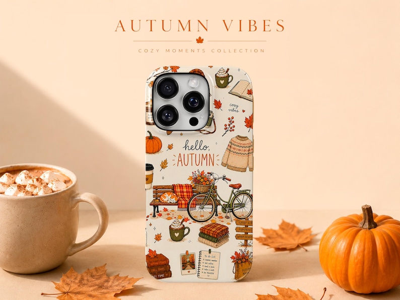 May include: A cream-colored smartphone case featuring a repeating pattern of autumn-themed illustrations including a bicycle, a bench, a sweater, pumpkins, mugs of hot cocoa, books, and fallen leaves, with the text hello, AUTUMN printed in the center.