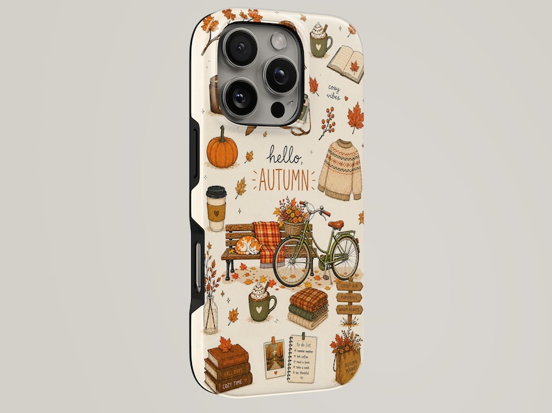May include: A cream-colored phone case featuring an autumn-themed pattern with illustrations of a pumpkin, a sweater, a bicycle, a bench, books, and mugs. The text "hello, AUTUMN" is printed in the center, surrounded by fallen leaves and seasonal icons.