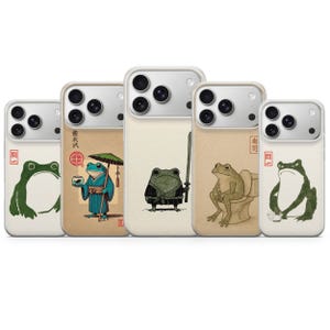 May include: A handmade wooden sign with the text "Welcome" in a playful font. The sign is painted white with a distressed finish, and features a decorative floral design in shades of pink and green. It measures approximately 12 inches wide.