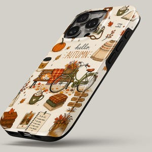 May include: A cream-colored phone case featuring an autumn-themed pattern with a green bicycle, a park bench, pumpkins, stacked sweaters, mugs of hot drinks, and falling leaves. The text "hello AUTUMN" is printed in the center of the design.