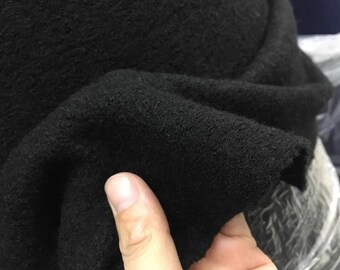 Le tissu en laine noir épaissit le tissu en laine tricoté, le nombre de pièces par mètre