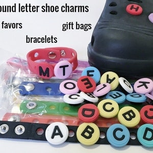 Letter shoe charms, unbranded clip, colored circles with black, alphabet, white, blue, pink, purple, yellow, red, turquoise, pink collegiate