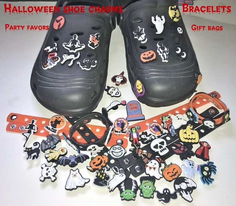 May include: A collection of Halloween-themed shoe charms and silicone bracelets featuring ghosts, pumpkins, skulls, bats, and monsters. The text HALLOWEEN SHOE CHARMS, BRACELETS, PARTY FAVORS, and GIFT BAGS is visible in red lettering across the top.