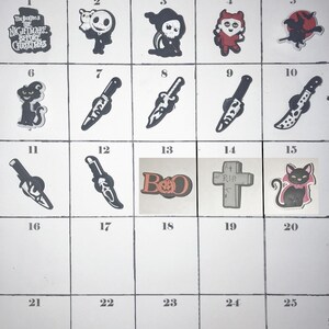 May include: A grid of Halloween-themed shoe charms labeled PAGE 74A-HALLOWEEN CHARMS. The collection includes icons like Jack Skellington, a grim reaper, a witch, various knives, a BOO sign with a pumpkin, a tombstone with R.I.P., and a black cat.