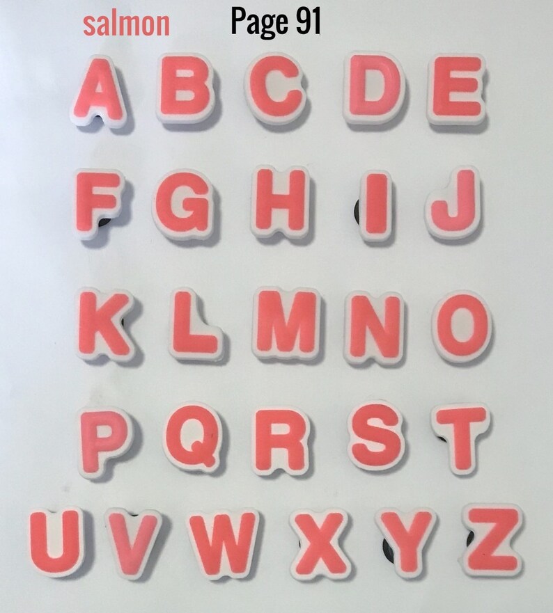 Puede incluir: Un conjunto de letras del alfabeto de color salm&oacute;n con bordes blancos. Las letras est&aacute;n dispuestas en filas y columnas, con el texto "salmon" y "Page 91" en la esquina superior izquierda.