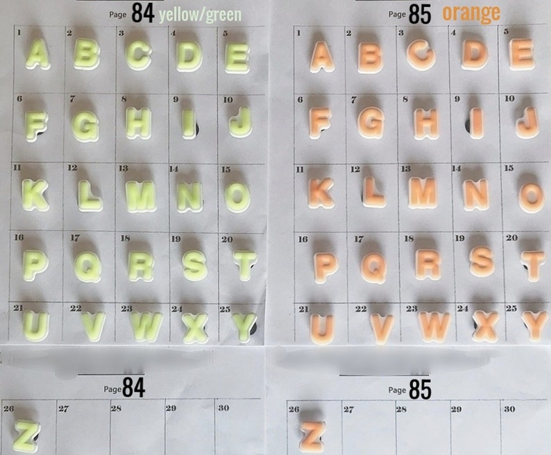 Puede incluir: Dos p&aacute;ginas de letras del alfabeto en una cuadr&iacute;cula. Una p&aacute;gina presenta letras amarillas/verdes, la otra naranja. Cada letra es un dise&ntilde;o hinchado y tridimensional. Las p&aacute;ginas est&aacute;n etiquetadas como "P&aacute;gina 84 amarillo/verde" y "P&aacute;gina 85 naranja".