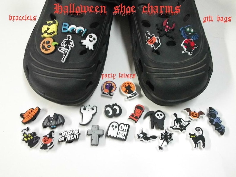 May include: A collection of Halloween-themed shoe charms featuring ghosts, pumpkins, bats, skeletons, and text like "Boo" and "Trick or Treat." The charms are displayed on and around two black clogs, with text overlays reading Halloween shoe charms, bracelets, gift bags, and party favors.