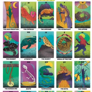 May include: A colorful tarot deck featuring illustrations of lizards and other reptiles. The cards are arranged in a grid, showing the major arcana, with the card number and name below each image.
