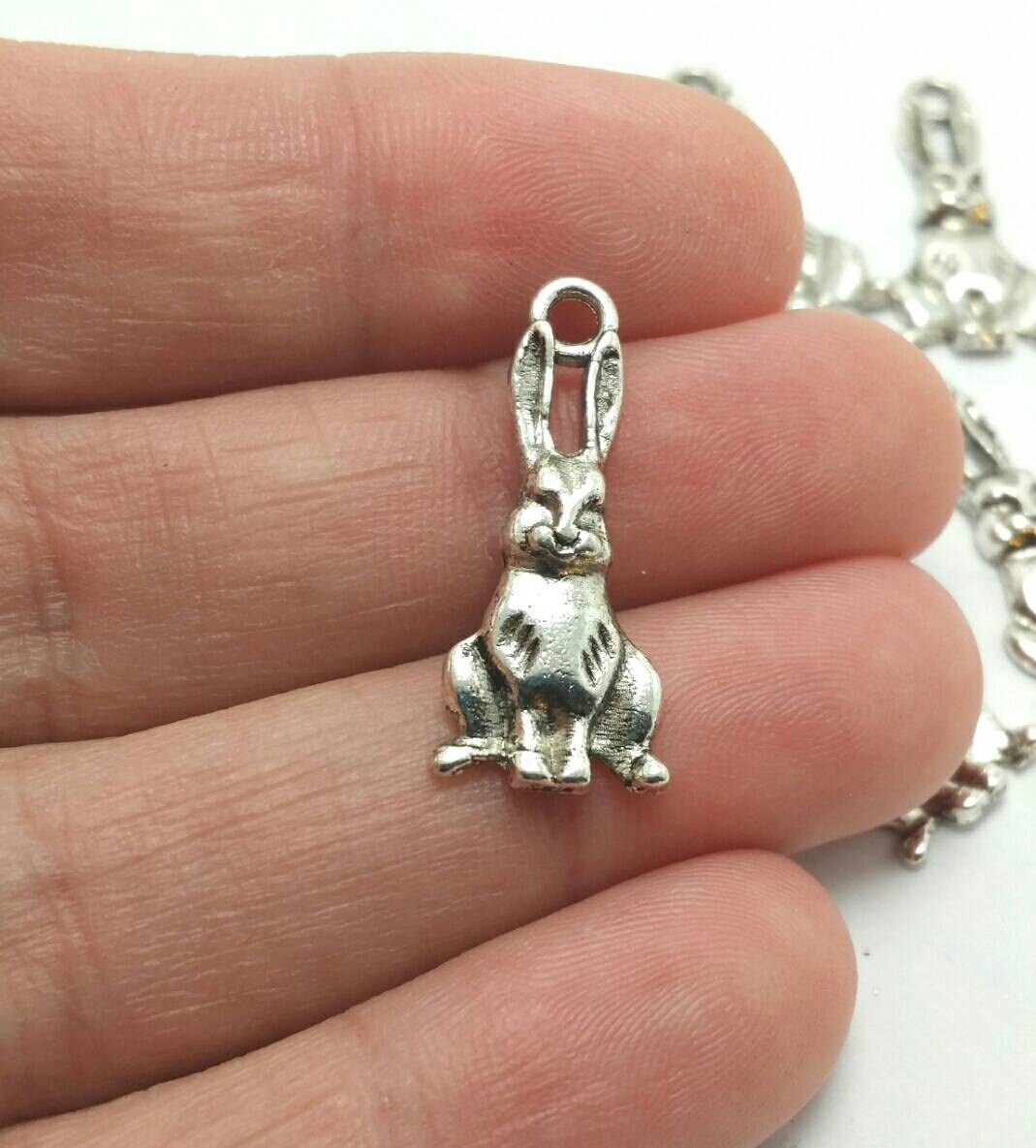 munching on a carrot...Very Cute! Universal use for Jewellery Check out our Fantastic wide range of EASTER Beads Card Making and Scrap-booking 10 x Antique Silver Bunny Rabbit Charms EASTER Charms and Findings with Jump Rings included for attachments 