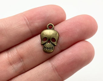 BULK 50 Skull Charms, Antique Bronze Tone, Halloween (5-1137)