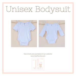 The image is a collage of two photographs of a white unisex baby bodysuit hanging on a clothesline. The text above the images reads "Unisex Bodysuit" and below the images, there is a note that says "Size charts are available on our website: www.twofreckle.com".