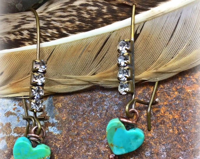 Itty bitty turquoise hearts dangle from rhinestones soldered on bronze ear wires