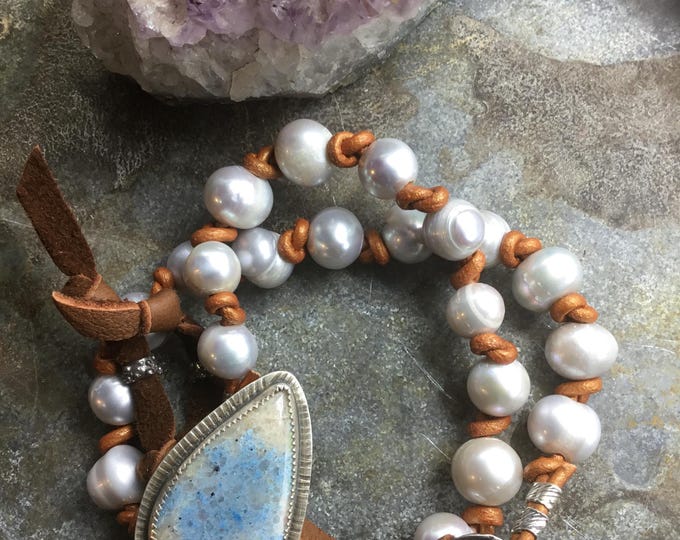 Double wrap pearl bracelet or necklace with bezel set stone closure with leather knotted pearls,leather loops around button slides for close