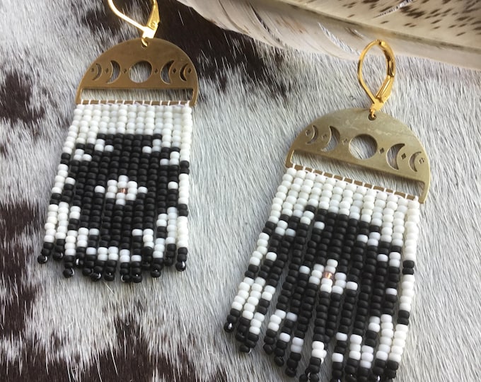 Beaded black and white Aztec pattern on bronze with bronze lever back ear wires very classic and can really dress up or down, lightweight to