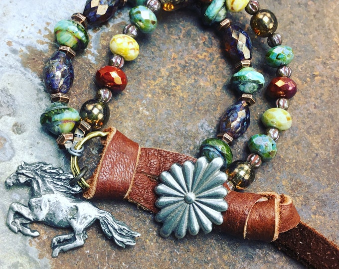 Stunning fire polished double layer Swarovski crystal beads with running horse and western concho style button closure with leather wrap