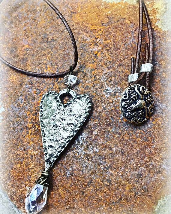 Very large heart pendant with Herkimer Diamond and quartz dangling below on leather cord with longhorn button closure, rustic jewelry
