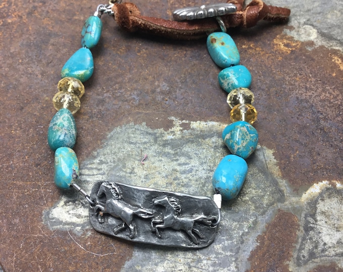 Prancing pretty ponies trot across this fun bracelet with turquoise and leather wrapped concho button closure mixed with faceted citrine