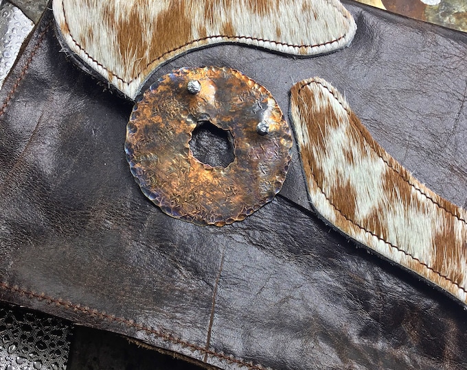 Distressed leather clutch bag with a steampunk vibe, one credit card inside pocket, funky fun pull up ring riveted on, gorgeous quality