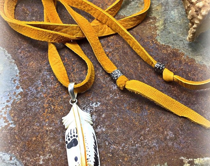 Hand painted bone feather with long palomino elk super soft leather with sterling accent beads simple wrap and tie the way you like it